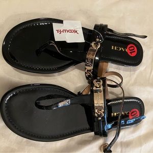 Brand new Black Gold Coach sandals